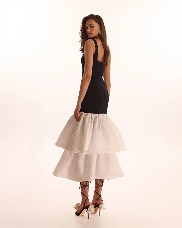 Black fitted maxi dress with white puffy tiered skirt Parisienne