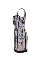 Alluring floral mini dress with bold lace up hook closure