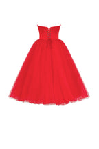 Dramatic red organza dress adorned with Millas signature and black gloves Xo Xo