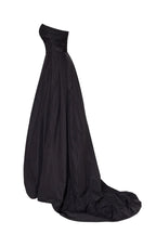 Black taffeta evening gown with a high slit and one shoulder wrap top