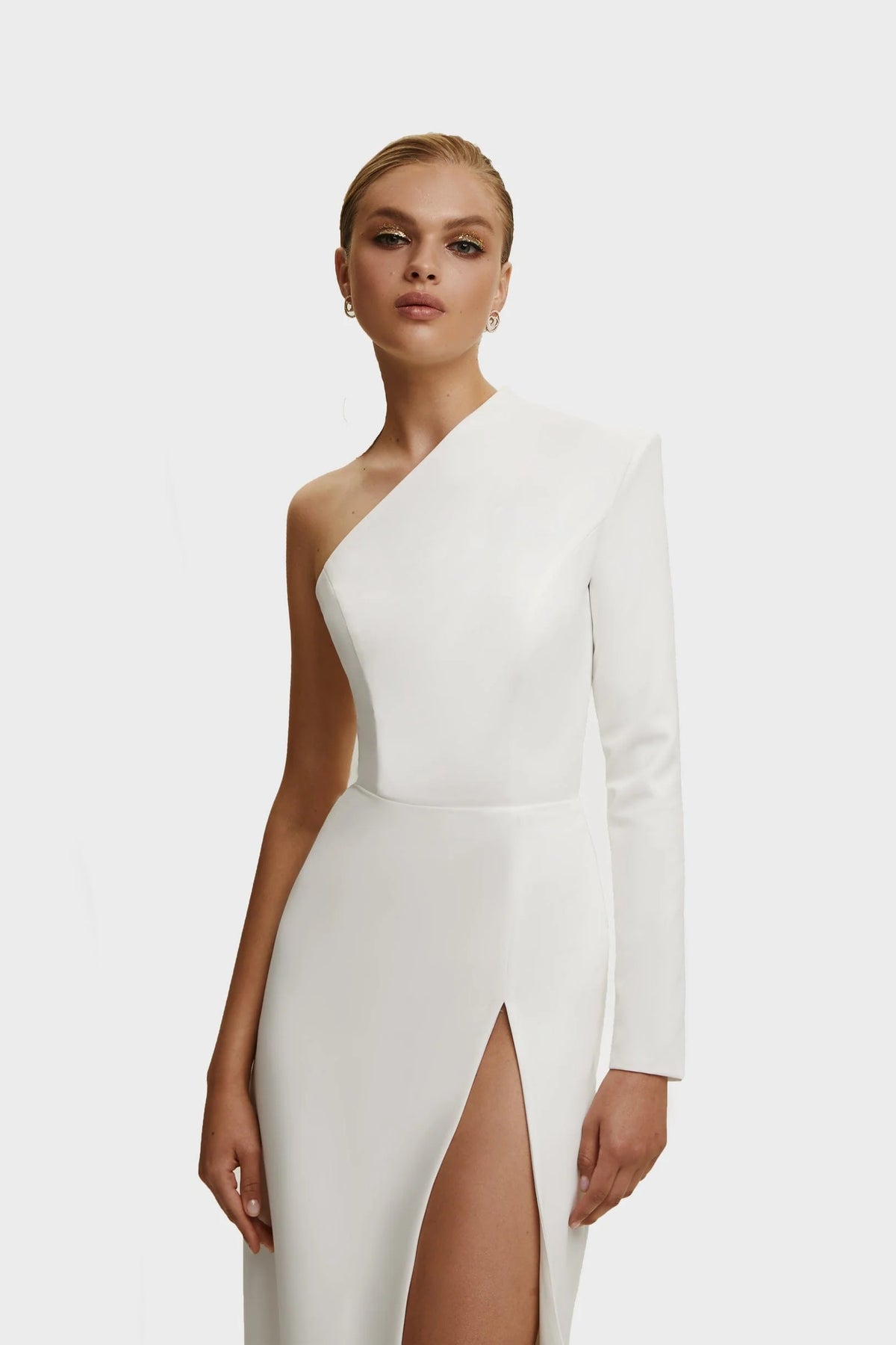 White Long sleeved dress with sharp shoulder cut