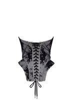 Black lace over the white mesh peplum corset with an oversized bow Parisienne