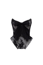 Black lace over the white mesh peplum corset with an oversized bow Parisienne