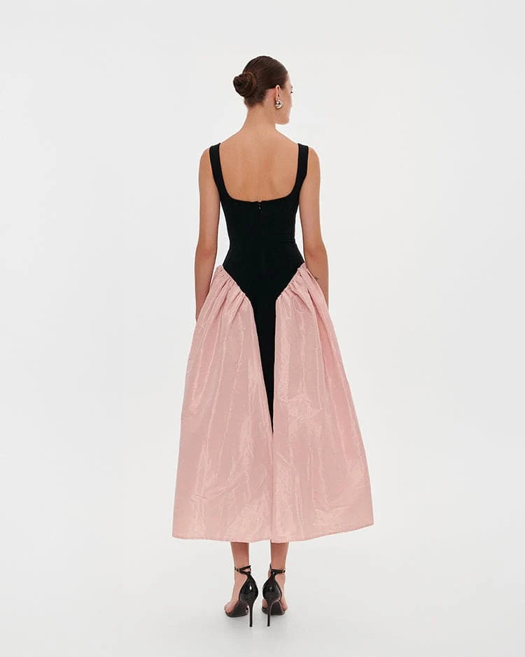 Black corset dress on straps with a glossy pink midi skirt