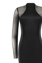 Showstopper black dress with semi transparent inserts