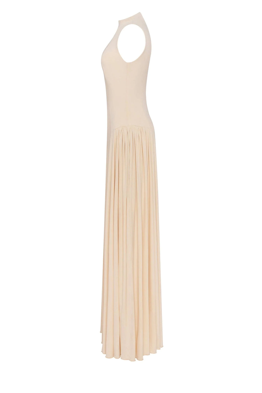 Nude sleeveless mock neck dress with a pleated maxi skirt