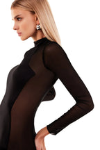 Showstopper black dress with semi transparent inserts