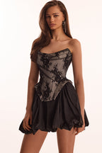 Black lace over the white mesh peplum corset with an oversized bow Parisienne