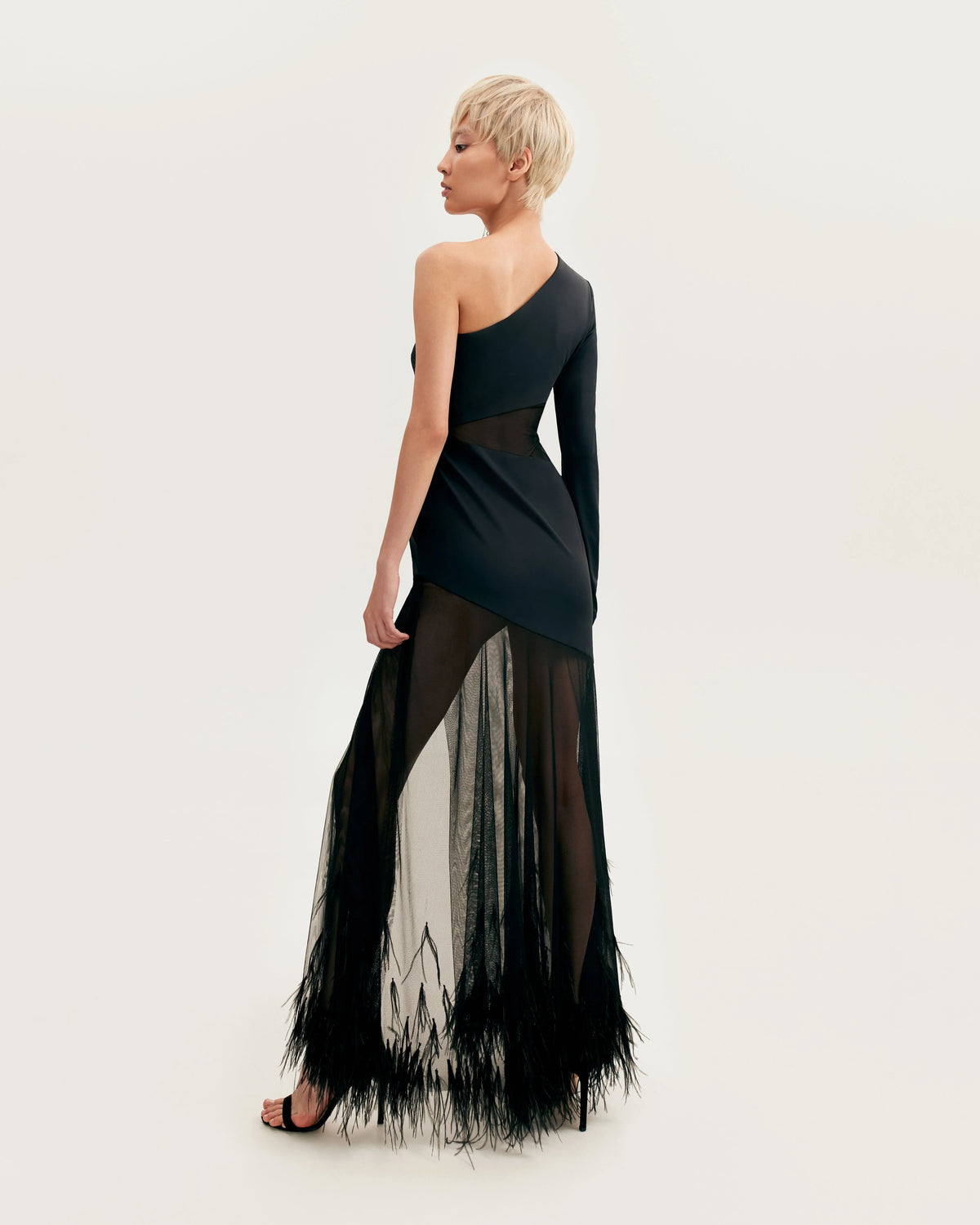 One shoulder maxi dress with feather trimmed bottom Xo Xo