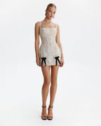Fitted nude mini dress with bows