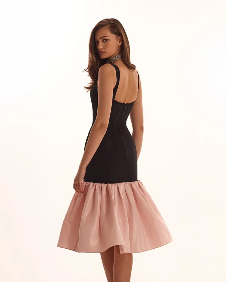 Black fitted maxi dress with pink puffy tiered skirt Parisienne