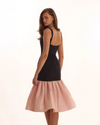 Black fitted maxi dress with pink puffy tiered skirt Parisienne