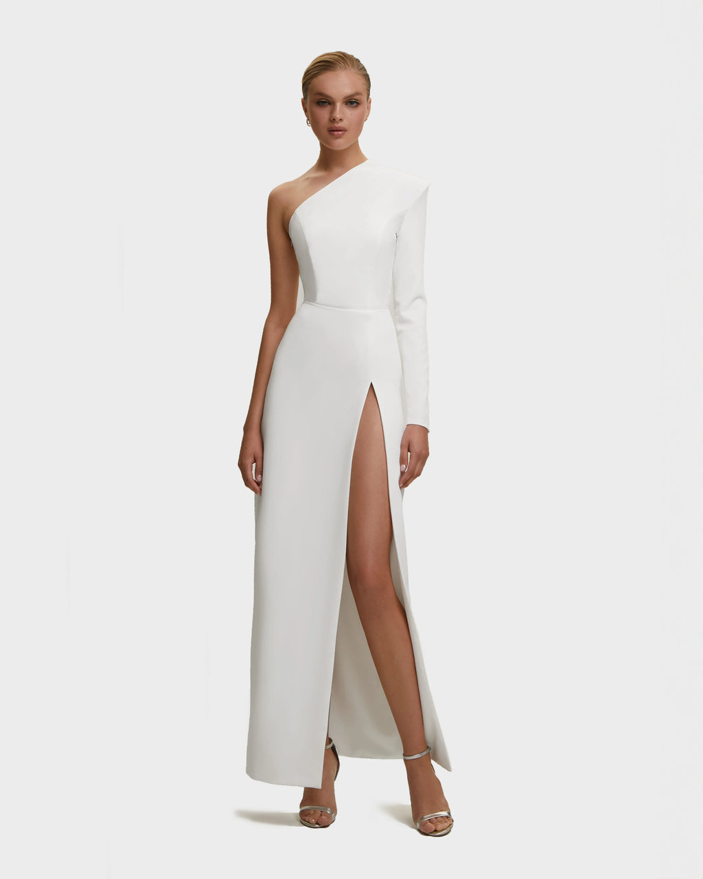 White Long sleeved dress with sharp shoulder cut