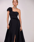Black taffeta evening gown with a high slit and one shoulder wrap top