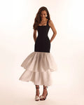 Black fitted maxi dress with white puffy tiered skirt Parisienne
