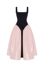 Black corset dress on straps with a glossy pink midi skirt